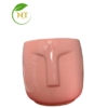 Chậu sứ mặt người